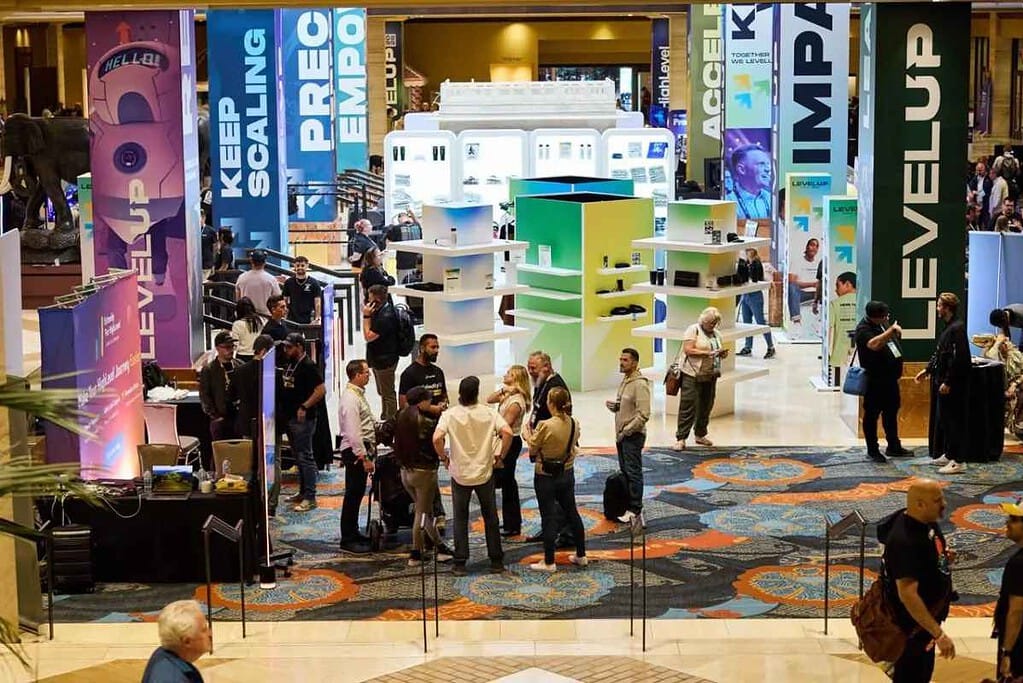 Attendees talking at the HighLevel LevelUp Summit exhibitor floor - GoHighLevel LevelUp Summit 2026